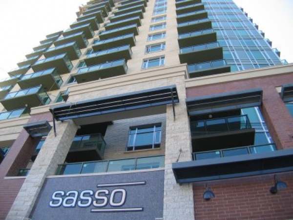 A tall building with many windows and balconies.