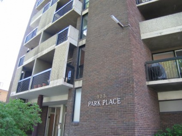 A brick building with the words " park place ".