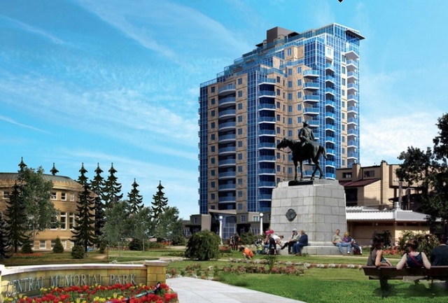 A statue of a man on top of a horse in front of a tall building.