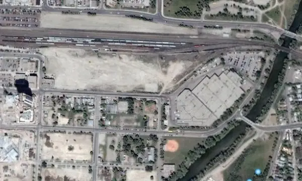 A satellite image of an industrial area with lots of buildings.